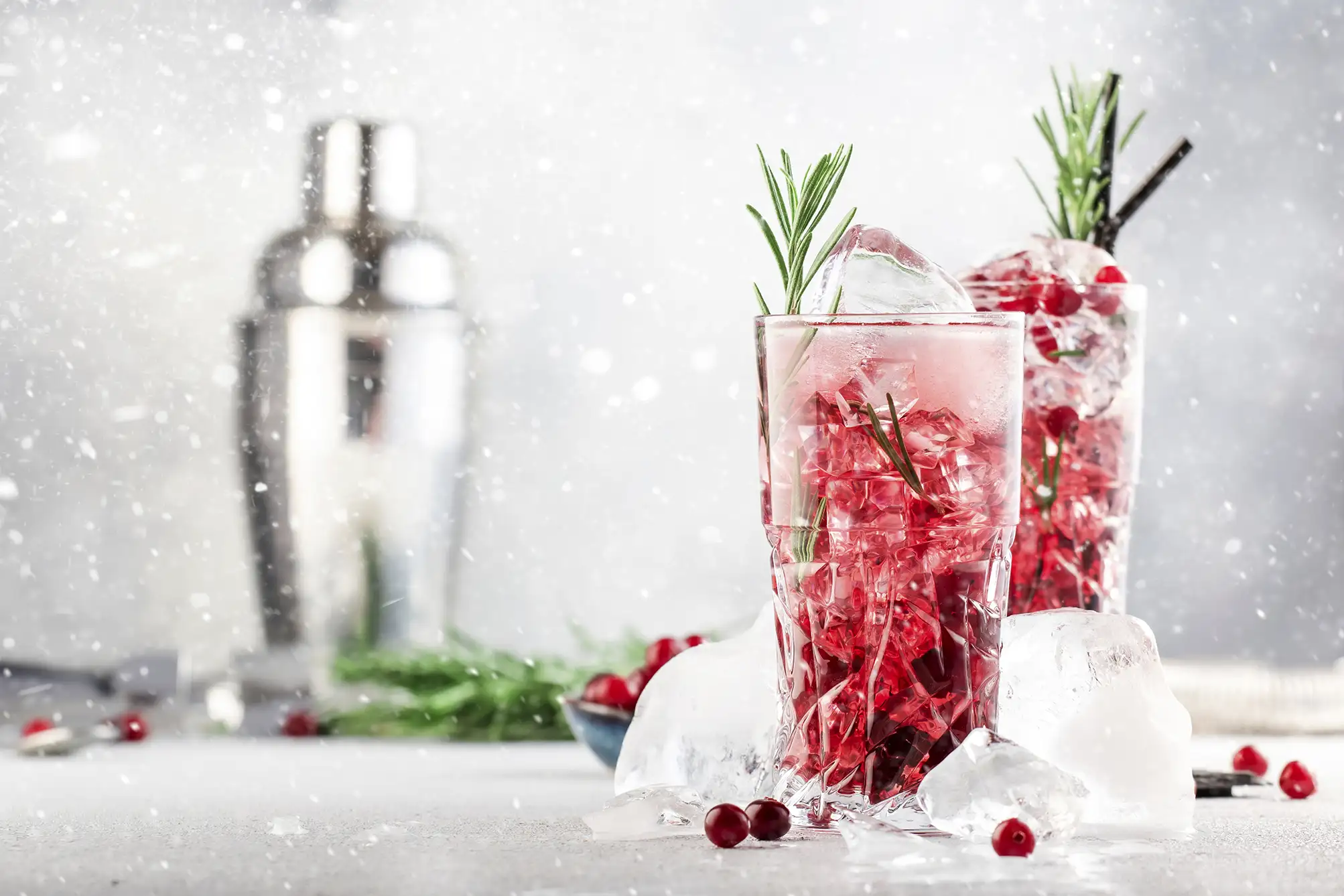 Red holiday themed cocktails set in a snowy environment