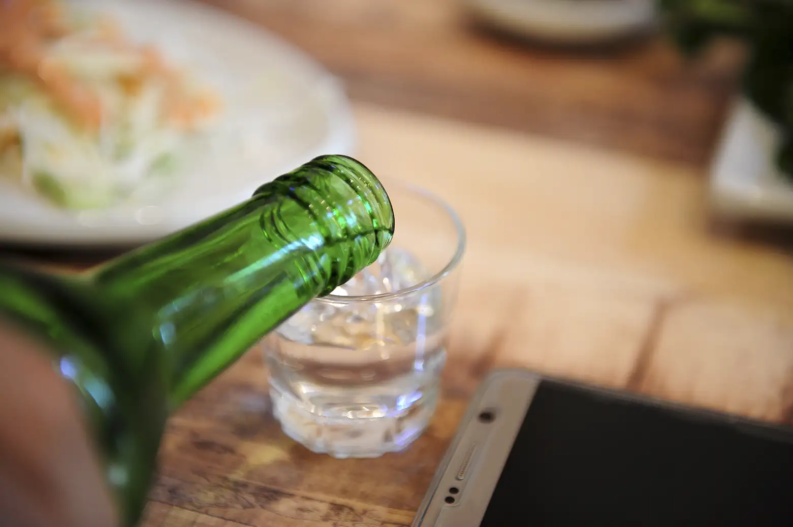 Soju being poured into a shotglass